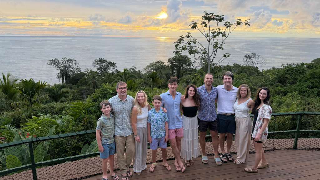 Guests enjoying dinner and a sunset view at La Cusinga Lodge in Uvita, Osa, Costa Rica