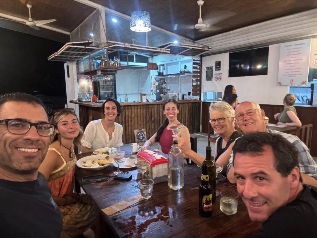 Guests enjoying a group dinner at Restaurante Kinsu in Uvita, Osa, Costa Rica