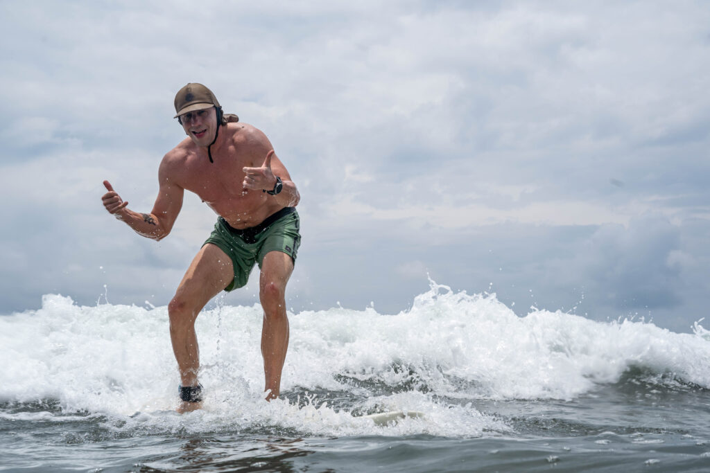 Surfing whitewater waves in the Marino Ballena National Park in Uvita, Osa, Costa Rica