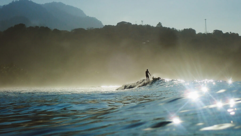 Surfing in the Marino Ballena National Park in the Osa Peninsula, Costa Rica