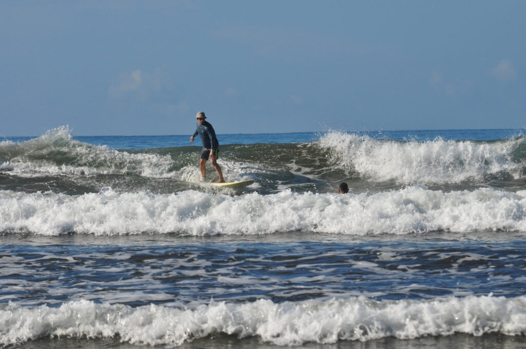 Surfing in the Marino Ballena National Park in Uvita, Osa, Costa Rica