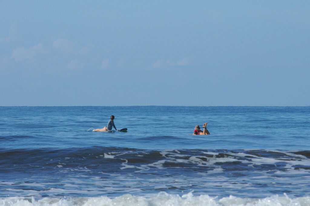 Surfing in the Marino Ballena National Park in Uvita, Osa, Costa Rica